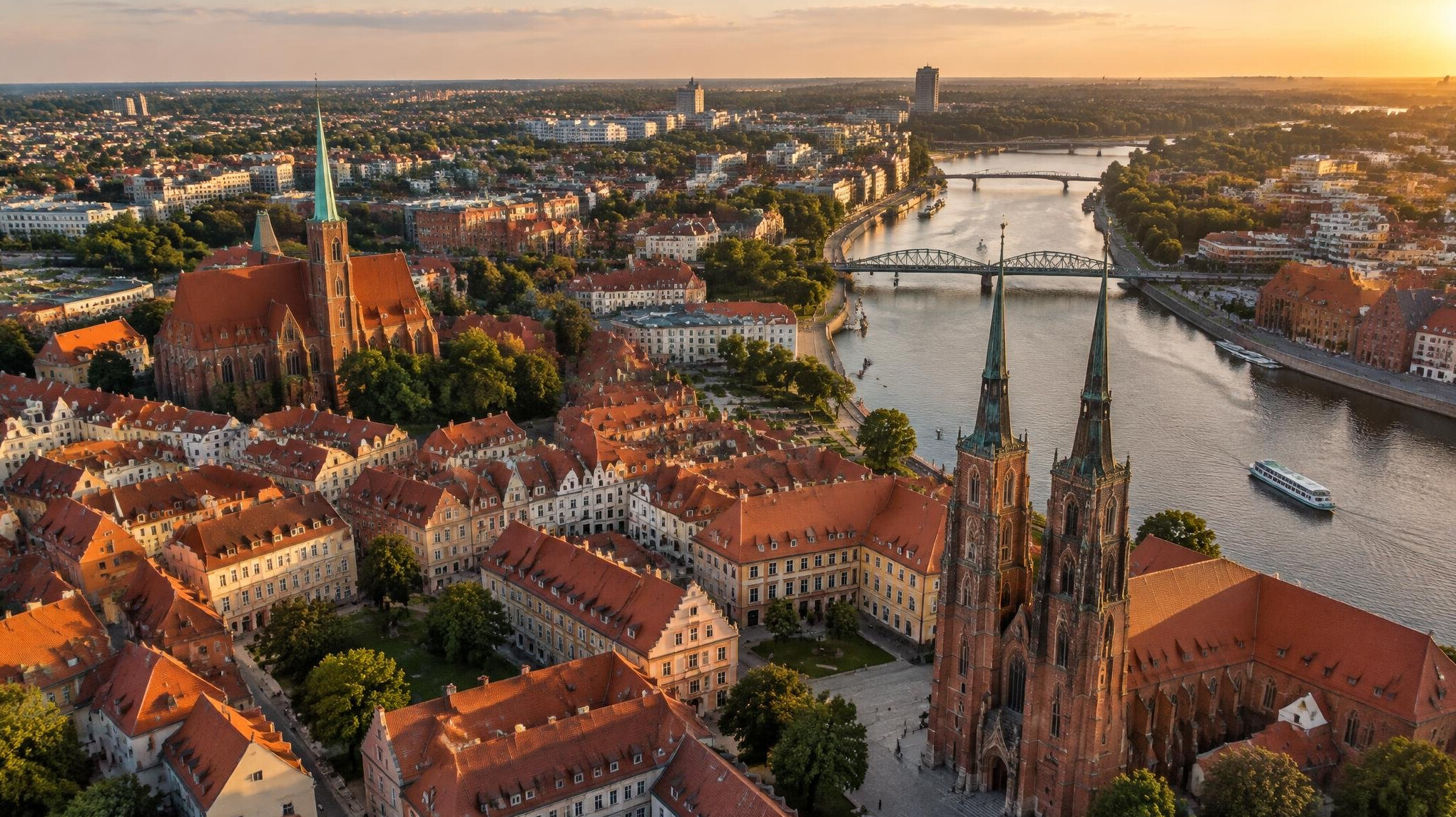 Aerial view of a city with rooftops and streets